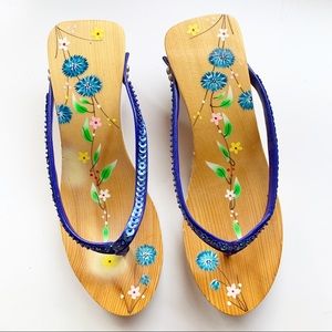 Wooden sandals with blue straps and flowers